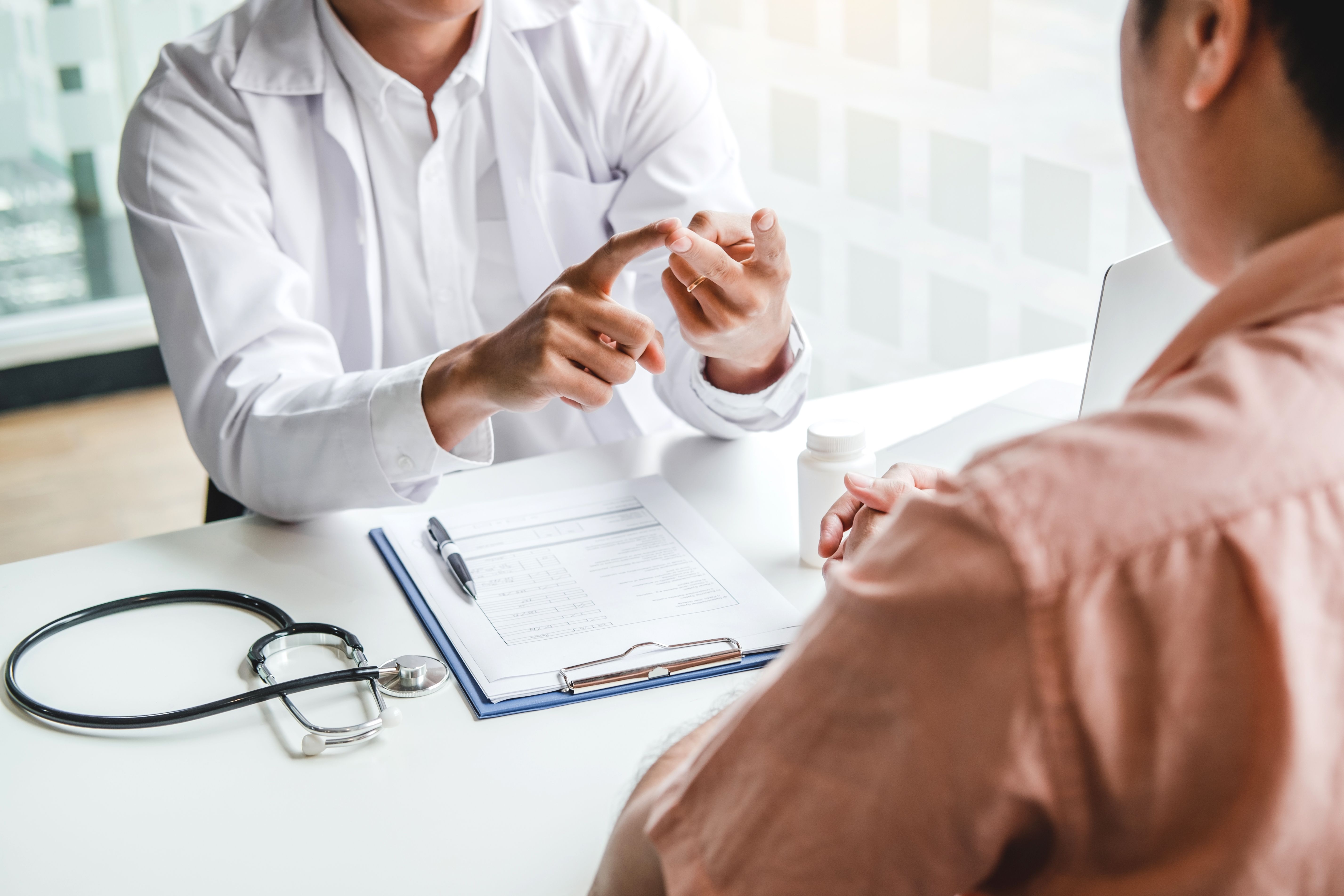 Doctor discusses treatment plan with the patient.
