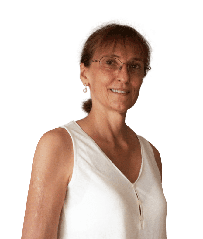 Smiling woman in white top with glasses.