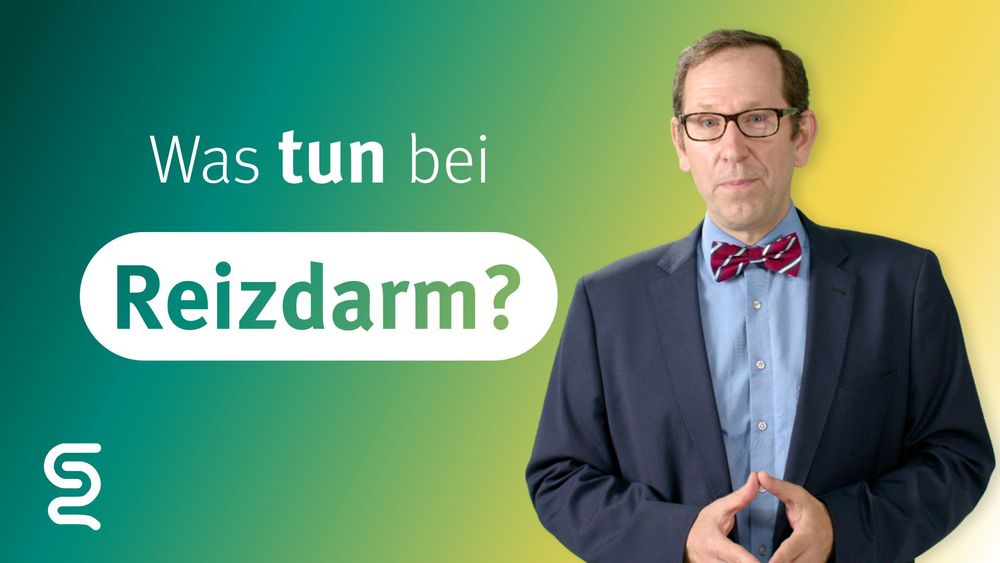 Man in suit discusses irritable bowel syndrome (Reizdarm).